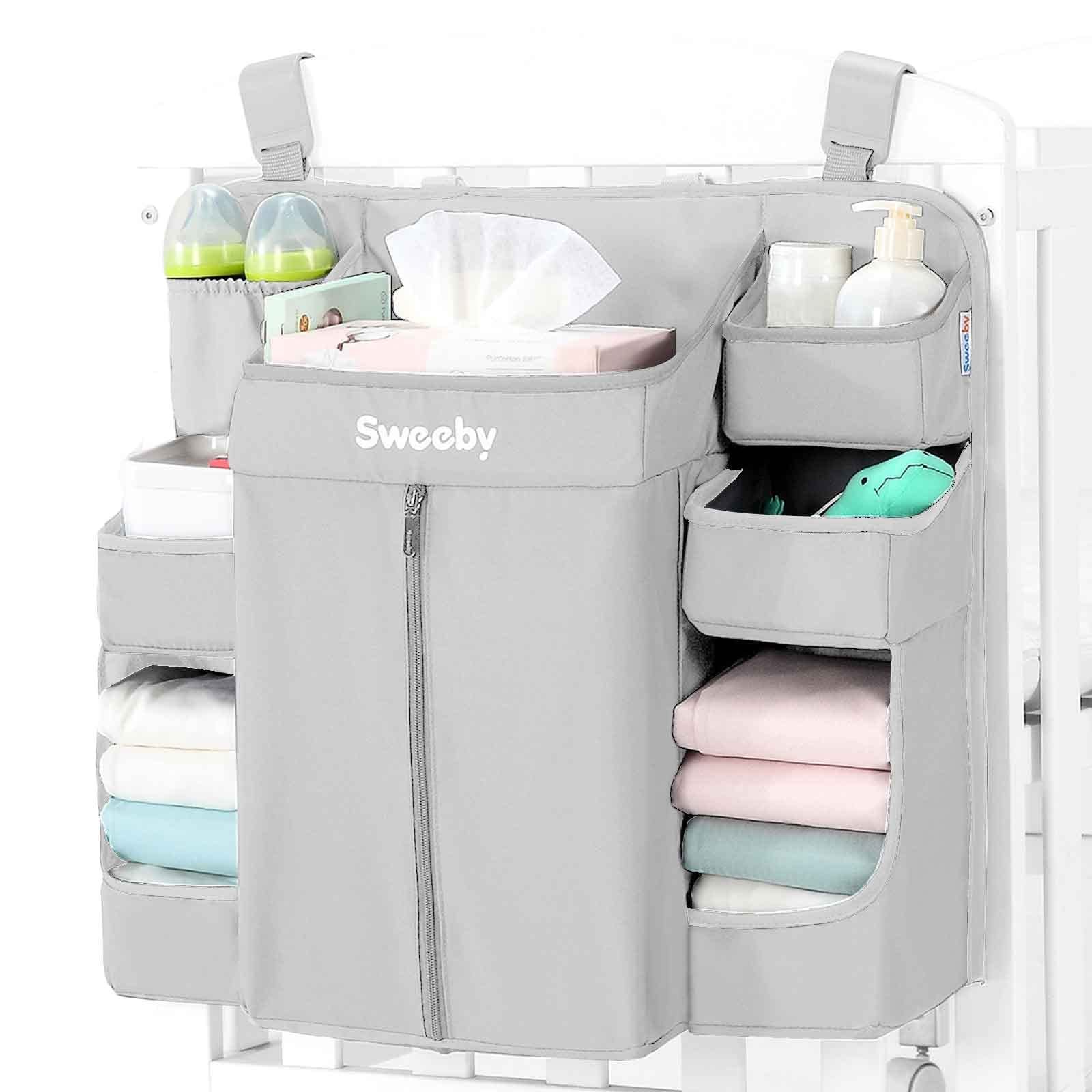 Sweeby diaper organizer on changing table closeup showing easy-access diaper pockets for quick changes