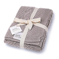 Sweet Acorn knit blanket closeup highlights chevron cables for cozy warmth