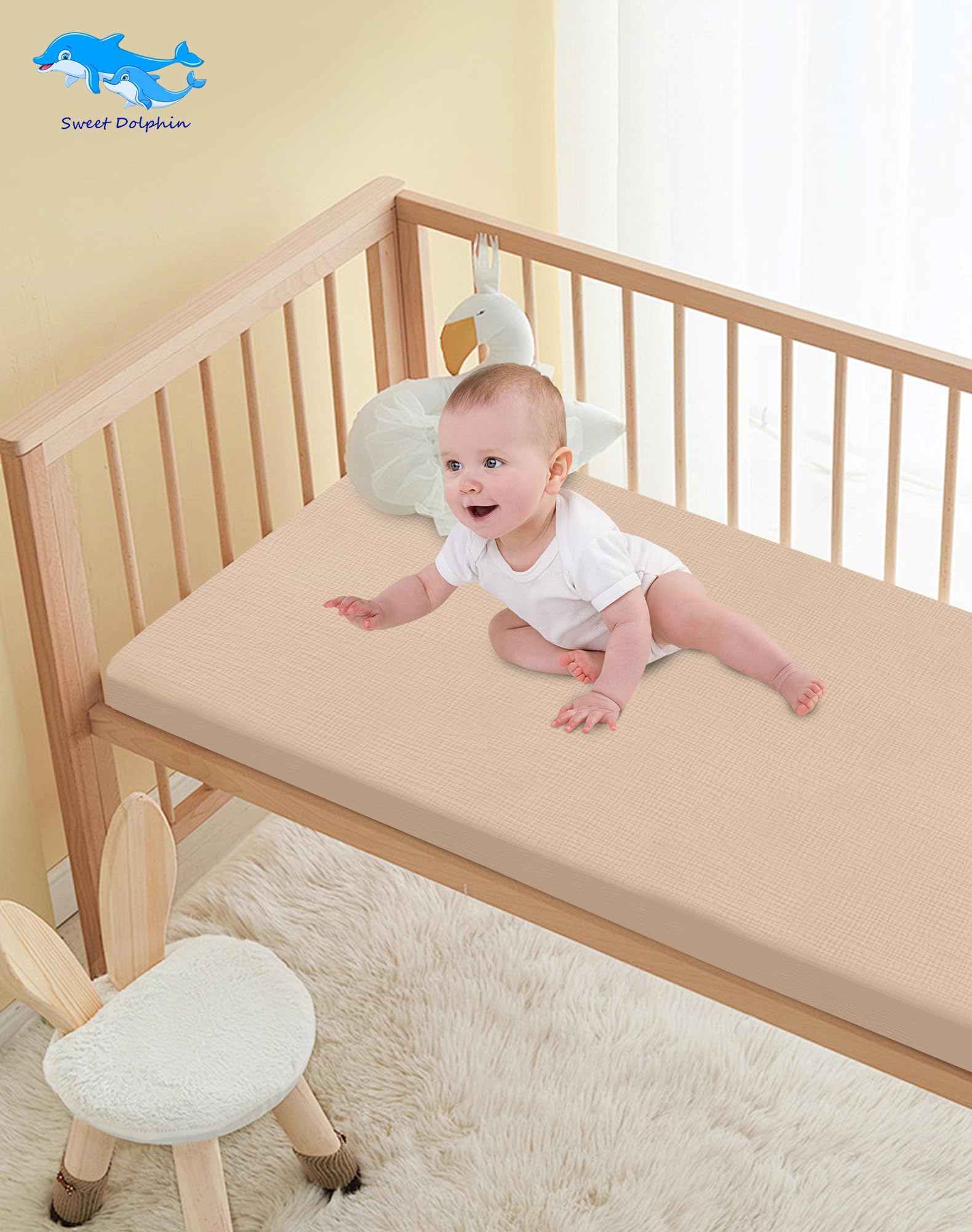 Sweet Dolphin muslin crib sheets in Light Bean Paste color to match nursery decor.