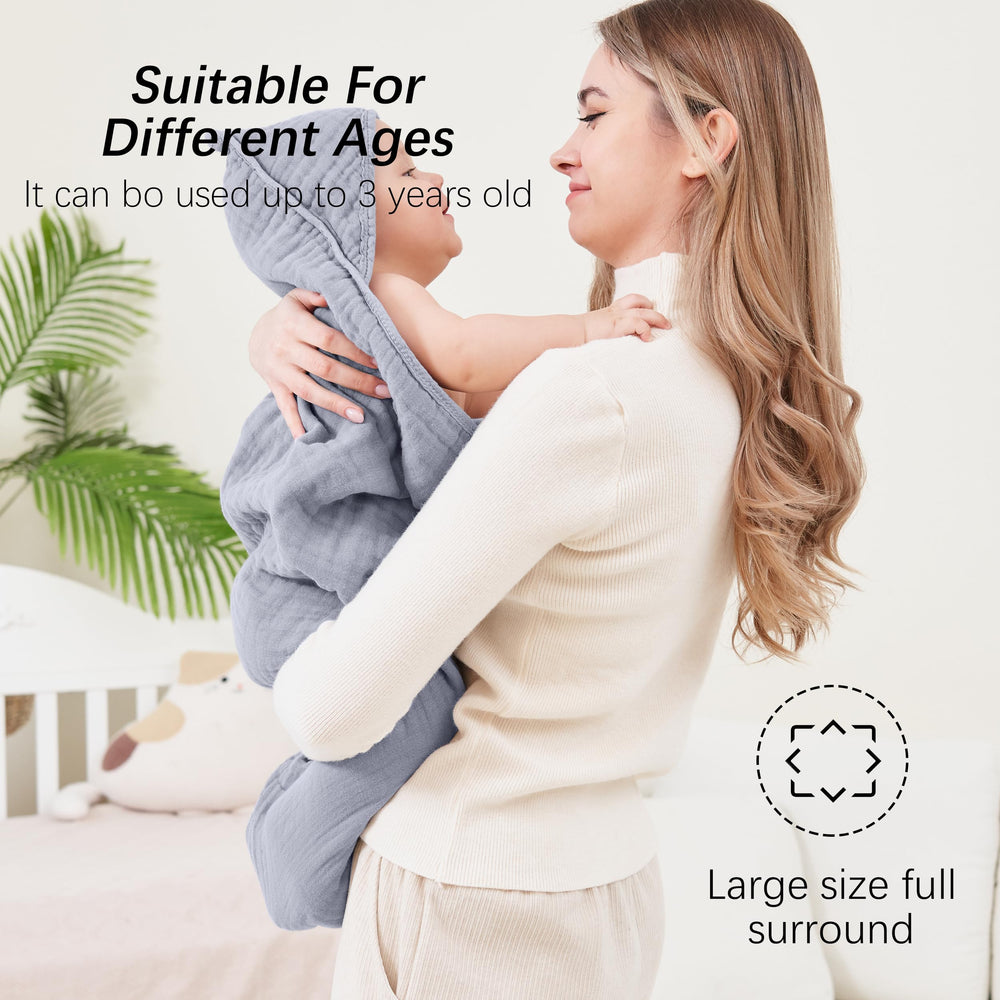 Sweet Dolphin Muslin Hooded Towel converts to baby blanket or changing mat cover for versatile use.