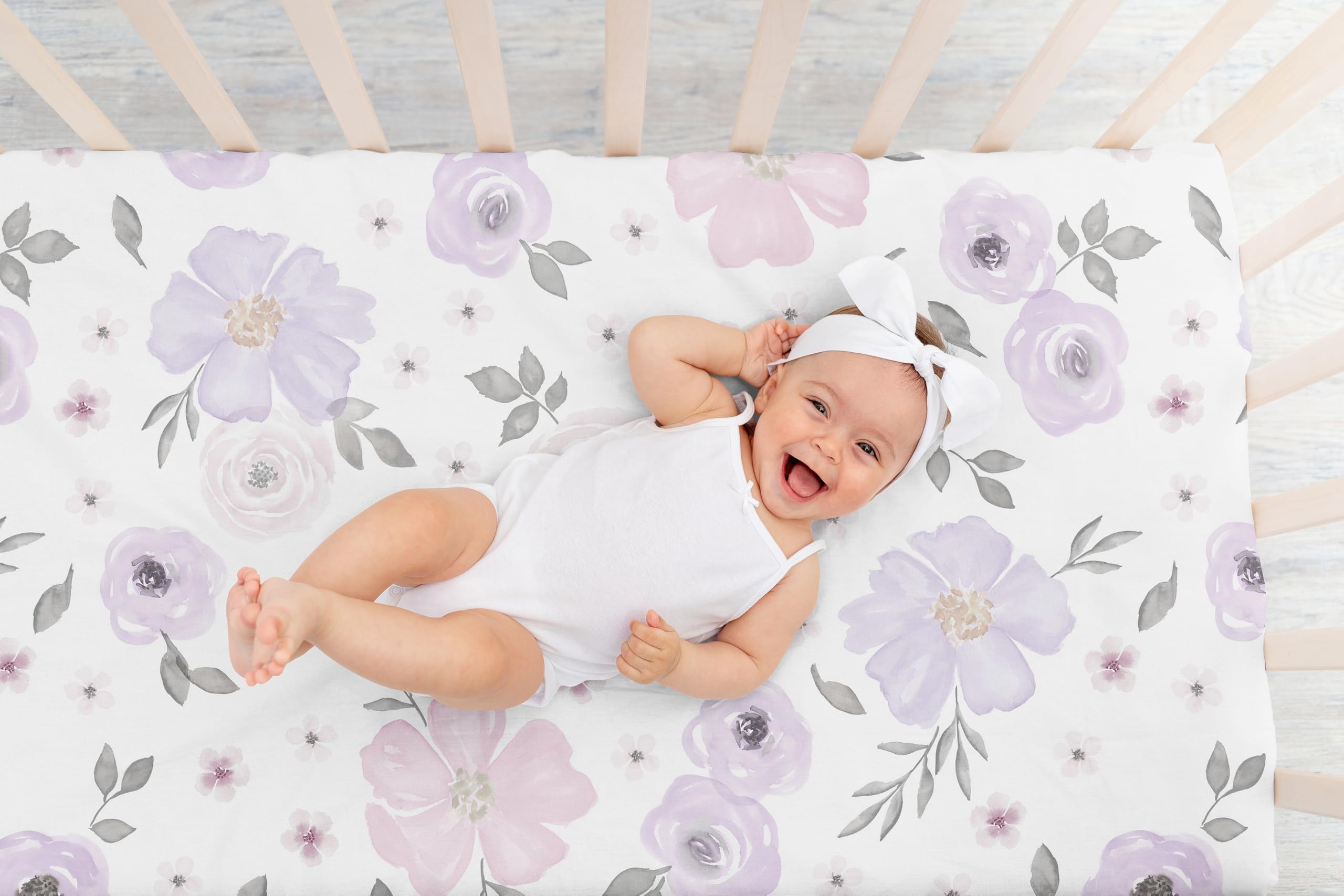 Sweet Jojo Designs crib sheets with snug-fit elastic edge minimize shifting.