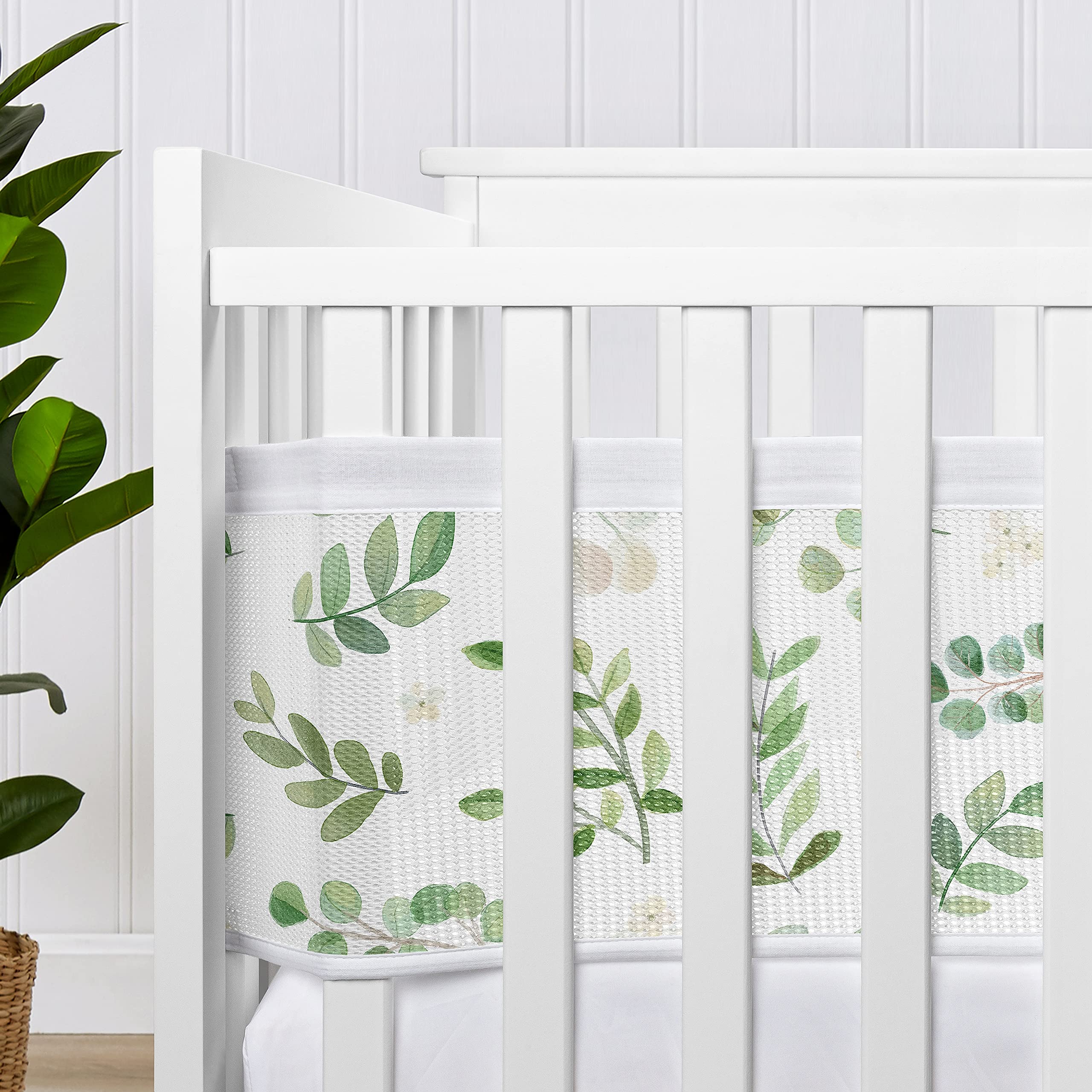 Sweet Jojo Designs liner set adds greenery while promoting snug, organized crib space.
