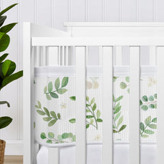 Sweet Jojo Designs liner set adds greenery while promoting snug, organized crib space.