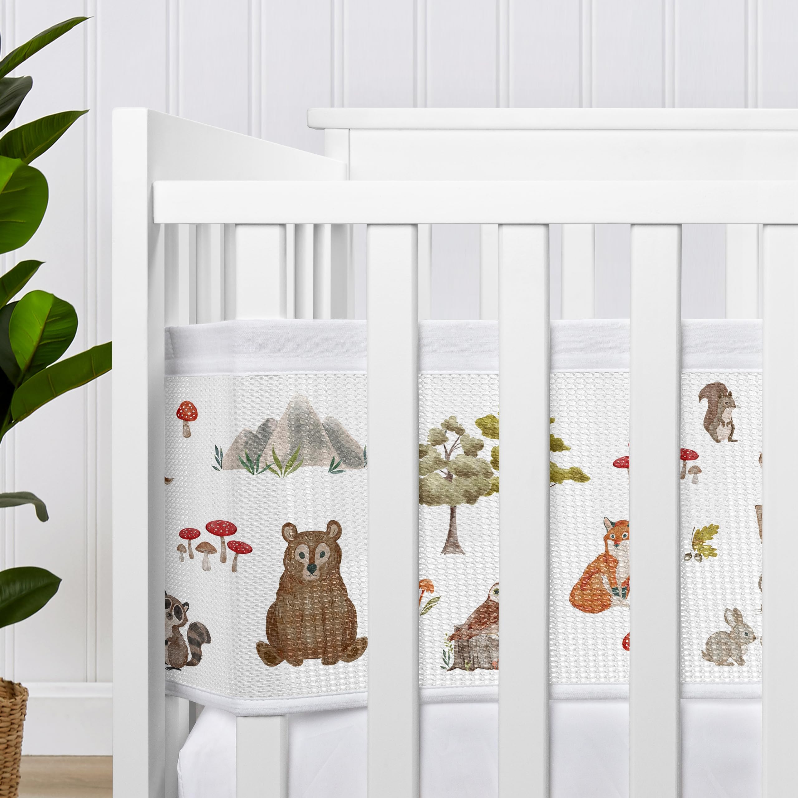 Sweet Jojo Designs breathable mesh crib liner with deer print helps keep baby content during naps.