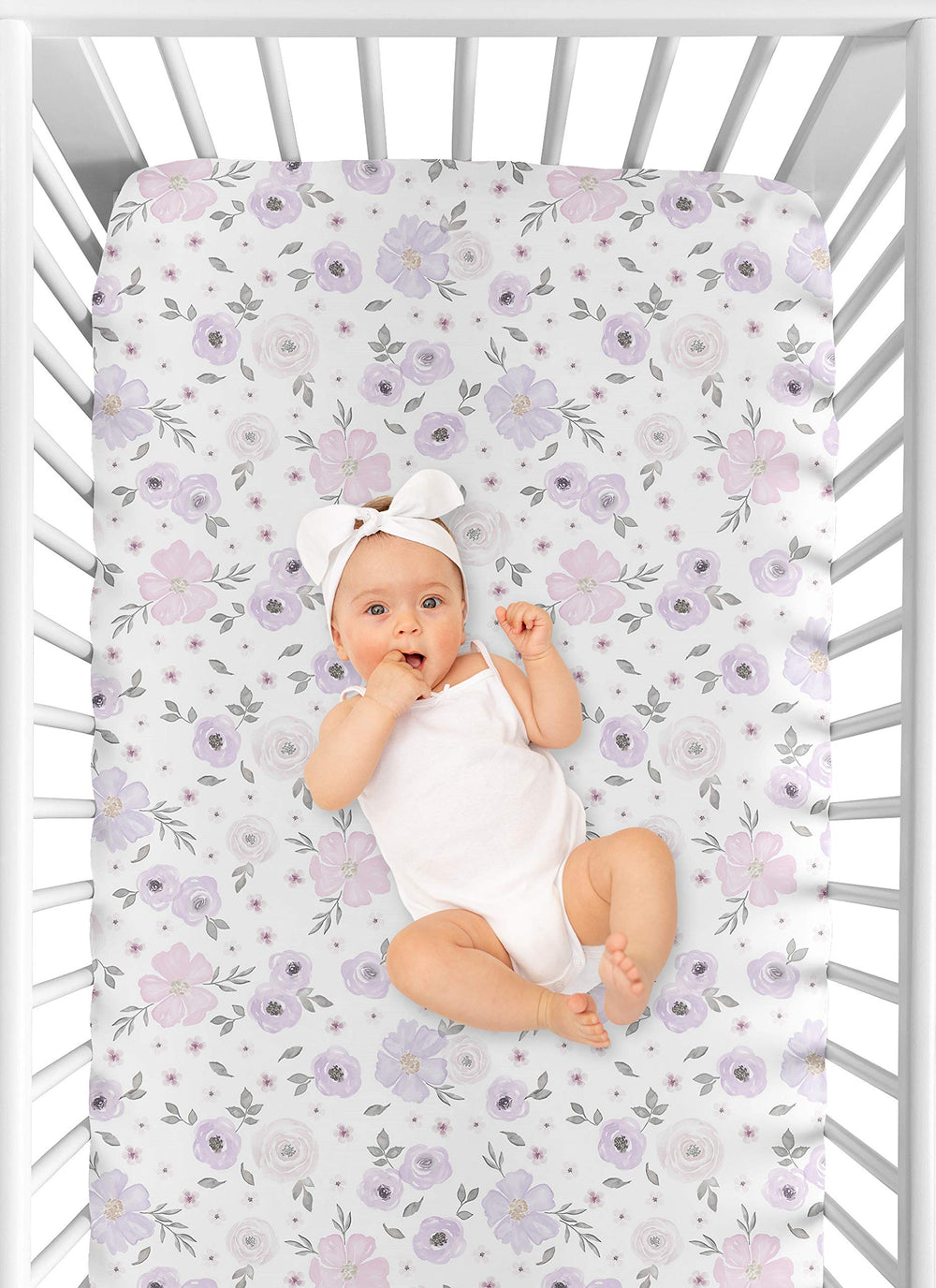 Sweet Jojo Designs crib sheets coordinate with lavender, pink, and grey nursery decor.