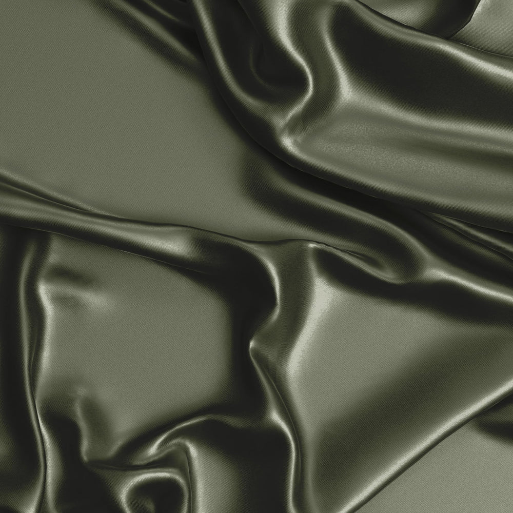 Sweet Jojo Designs dark green satin fitted crib sheet on mattress with secure elastic edge.