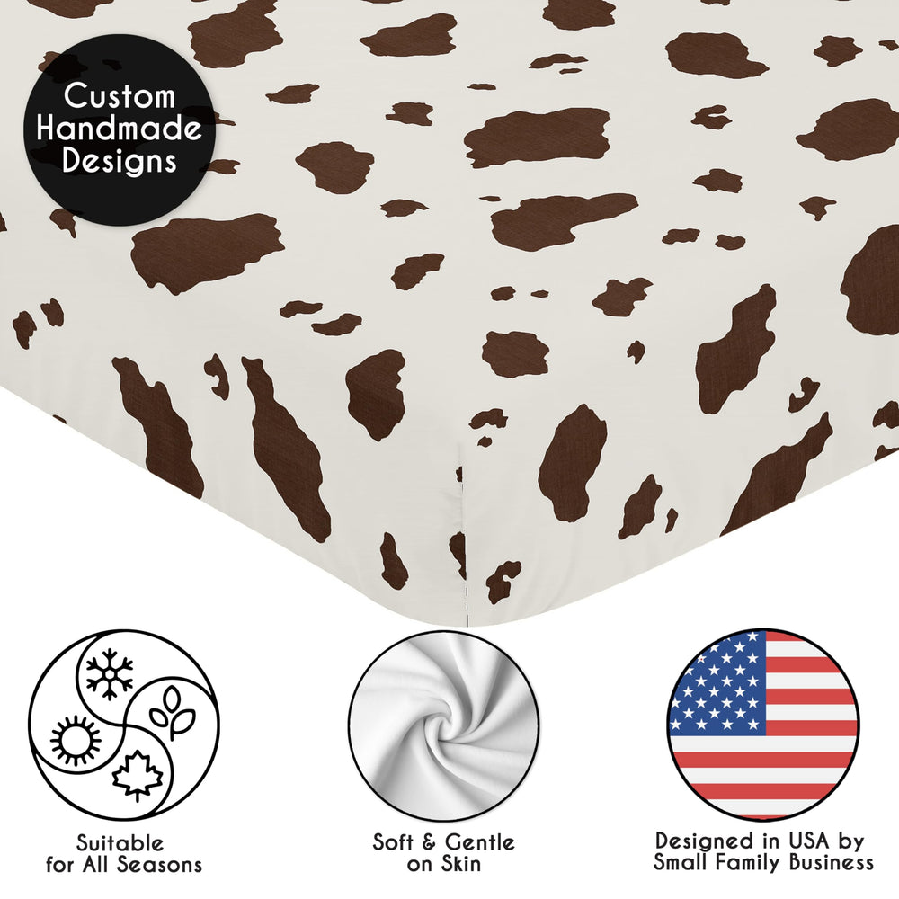 Sweet Jojo Designs cow print crib sheet offers gender-neutral design for nursery versatility.