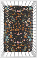Sweet Jojo Designs mini crib sheet in black wildflower offers a snug fit for cozy sleep