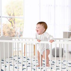 Sweet Jojo Designs Moon Star satin crib sheet in a cozy nursery setup with celestial decor.