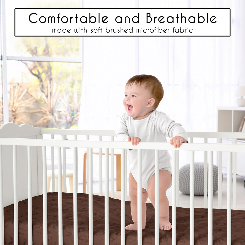Sweet Jojo Designs neutral brown-tan-red crib sheets suit a versatile western nursery.