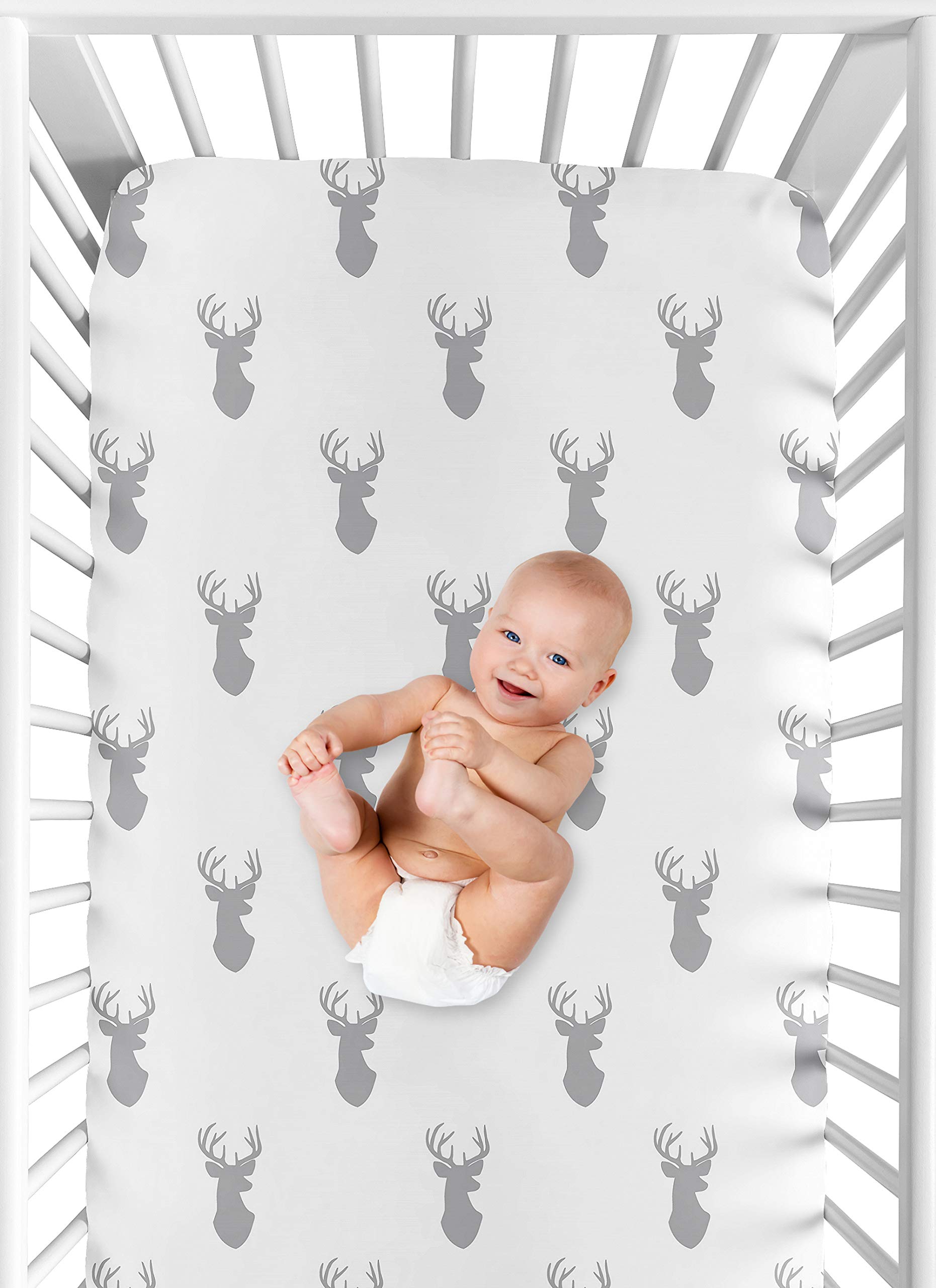 Forest-themed nursery decor coordinates with woodland bedding and accessories.