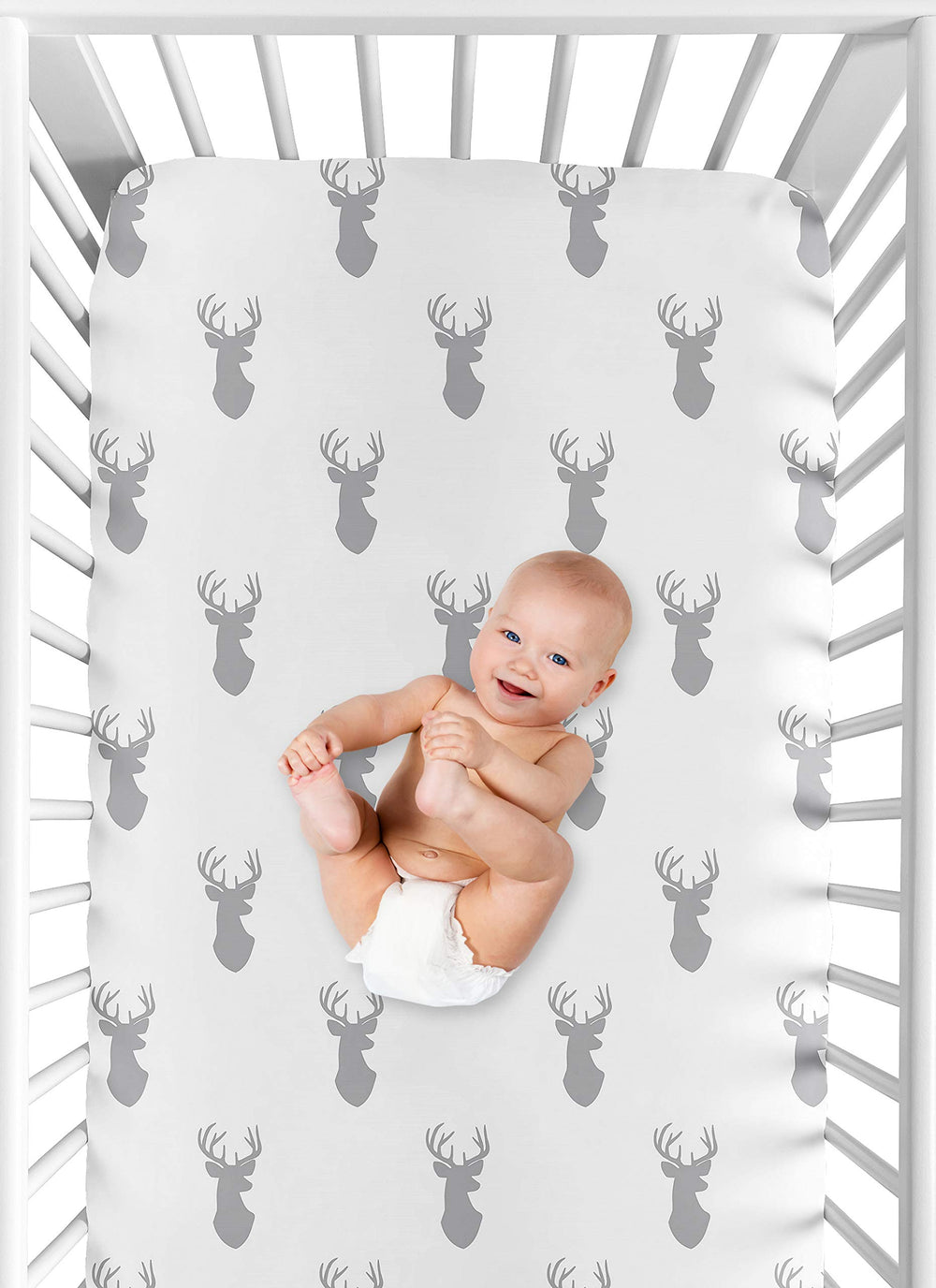 Forest-themed nursery decor coordinates with woodland bedding and accessories.