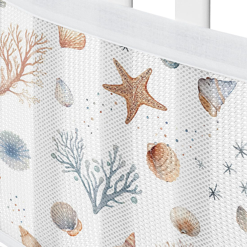 Sweet Jojo Designs Ocean Seashells reinforced ties secure mesh liner to crib.