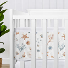 Sweet Jojo Designs Ocean Seashells visual shield promotes calmer nursery sleep.