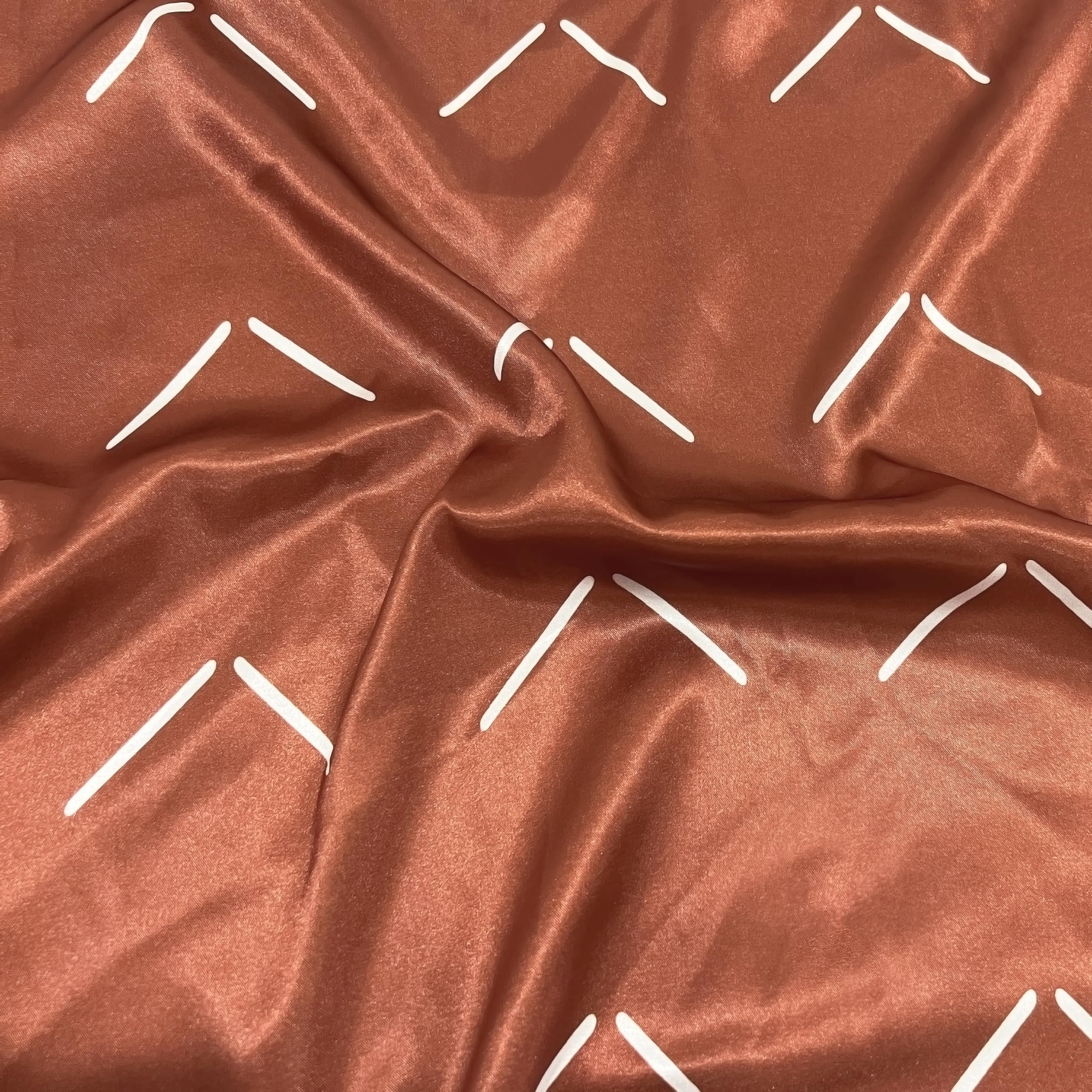 Sweet Jojo Designs satin crib sheet on a crib demonstrates secure fit with elastic bottom.