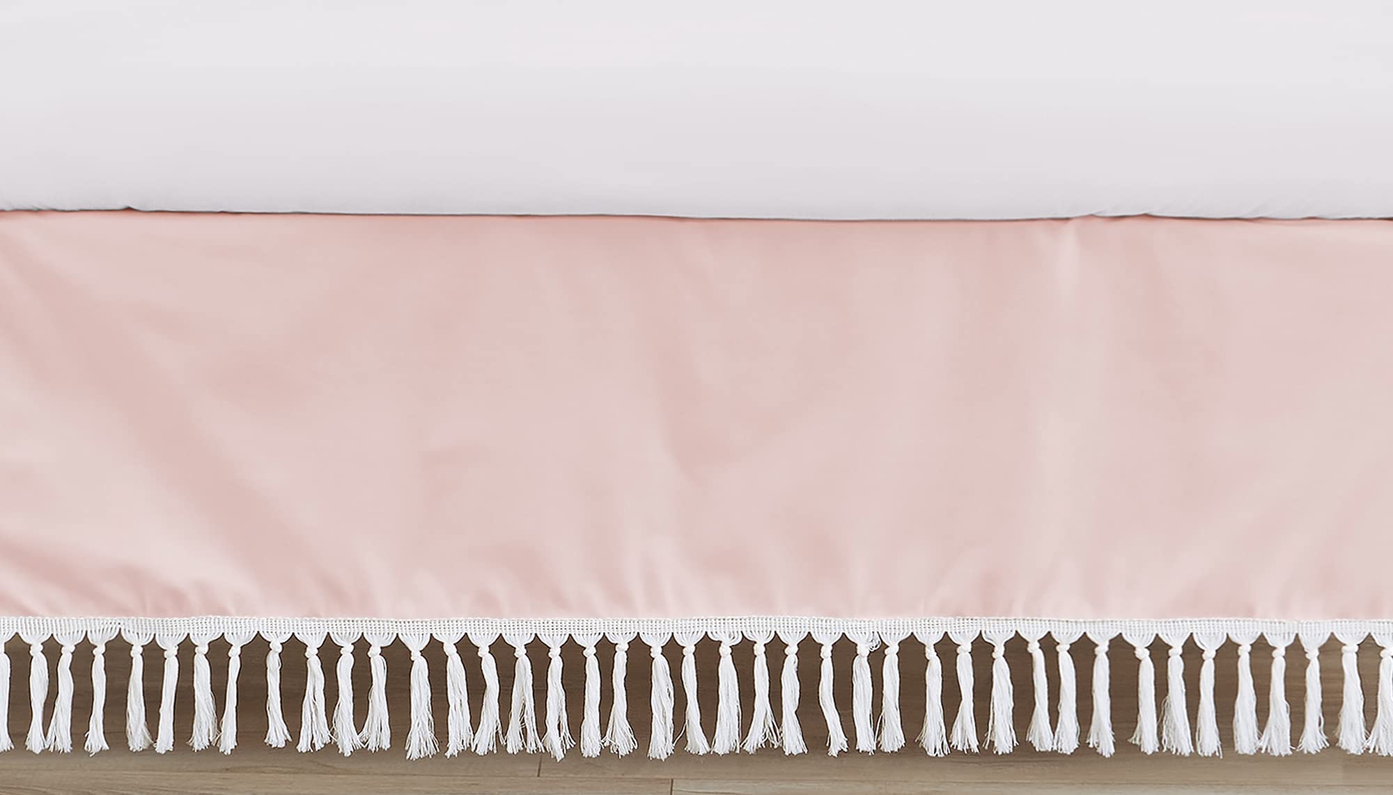 Sweet Jojo Designs pink boho crib skirt draped on a standard crib for a polished nursery.