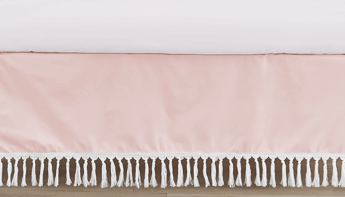 Sweet Jojo Designs pink boho crib skirt draped on a standard crib for a polished nursery.