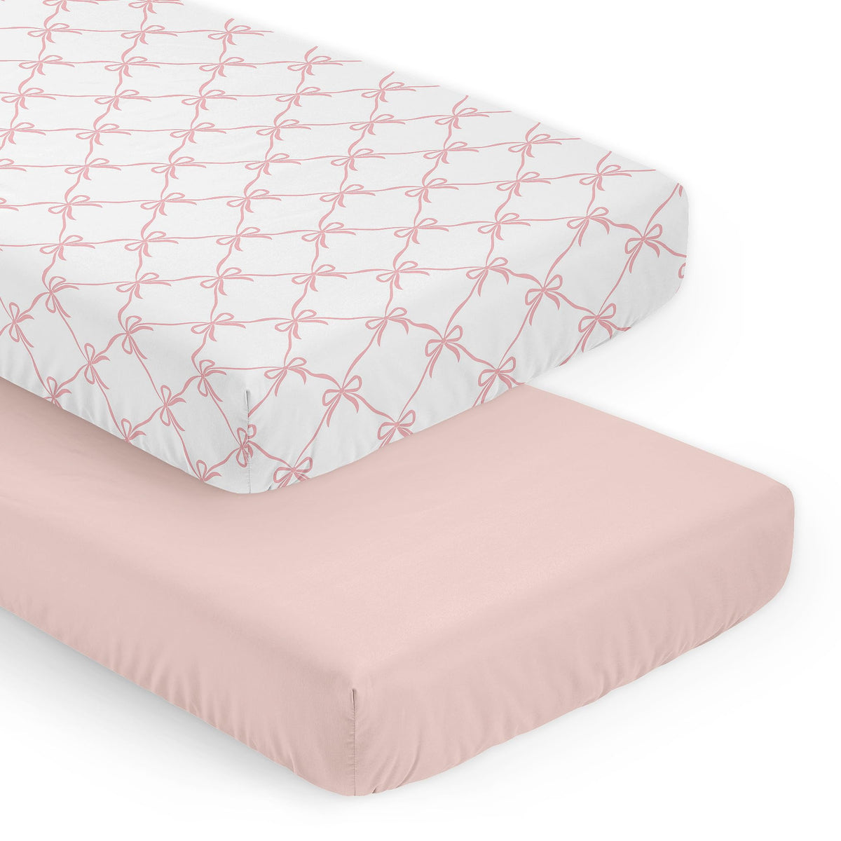Sweet Jojo Designs pink bows crib sheet closeup, showcasing soft fabric and snug fit.