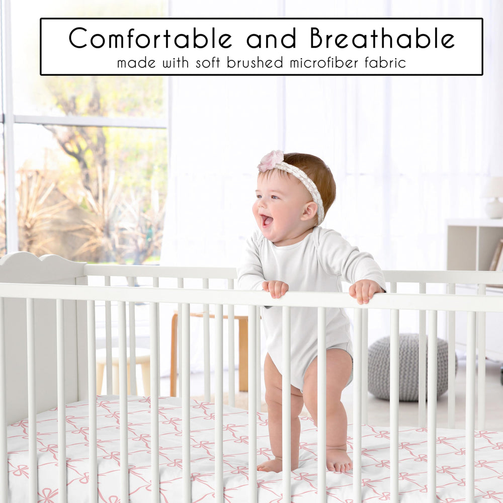 Sweet Jojo Designs pink bows crib sheet folded; easy storage and quick changes.