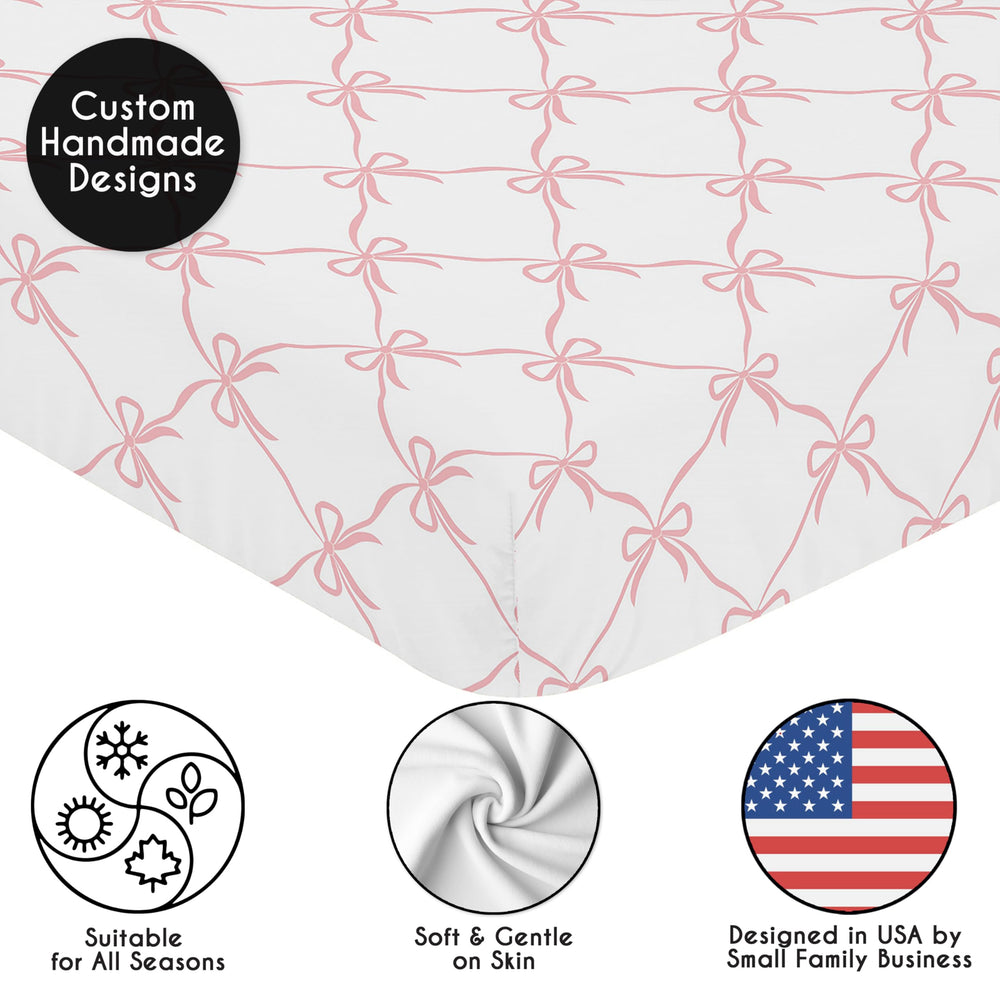 Sweet Jojo Designs pink bows crib sheet on a toddler bed; coordinates with other sets.