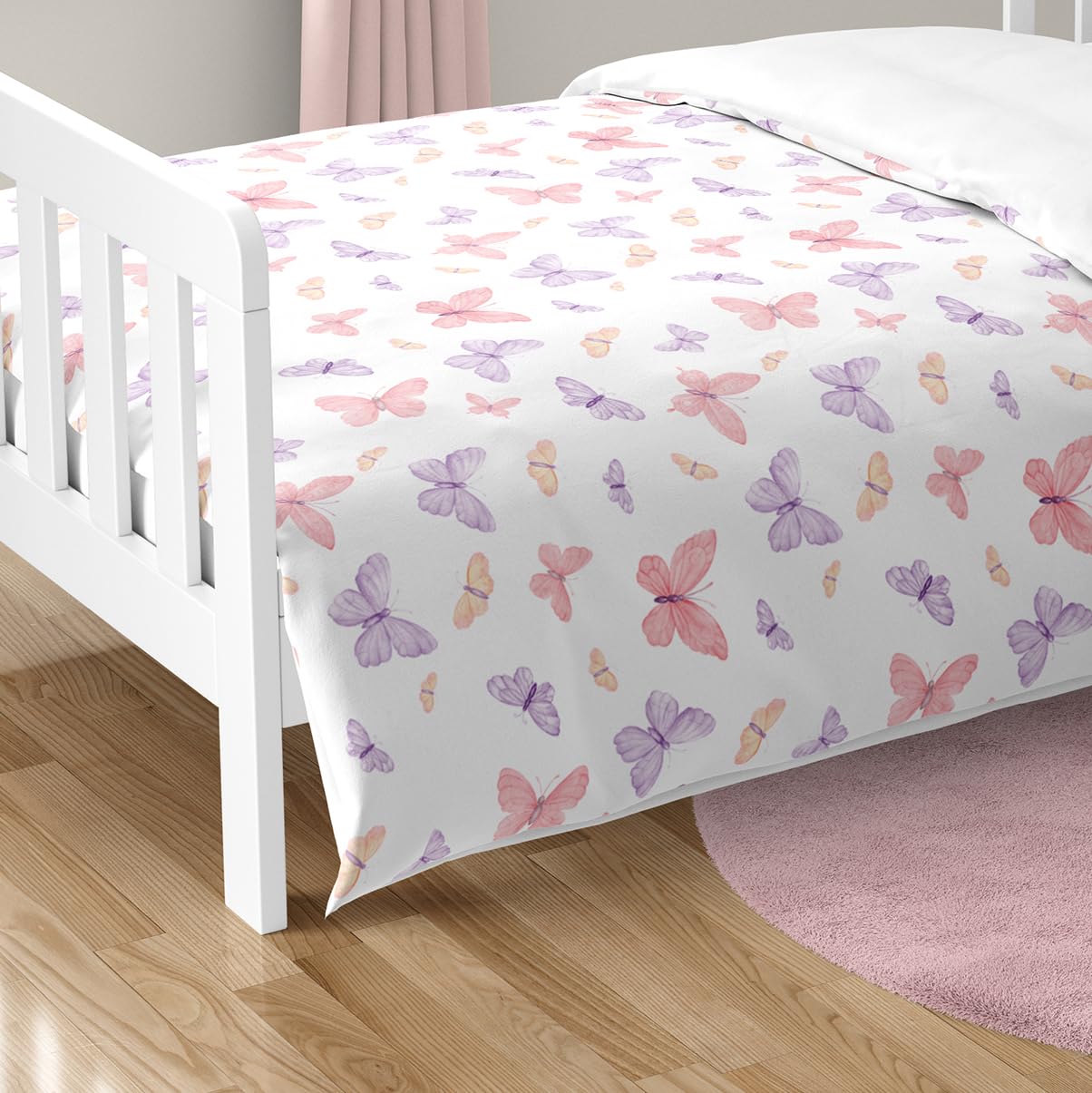 Sweet Jojo Designs butterfly bed set displayed on a toddler bed for reference.
