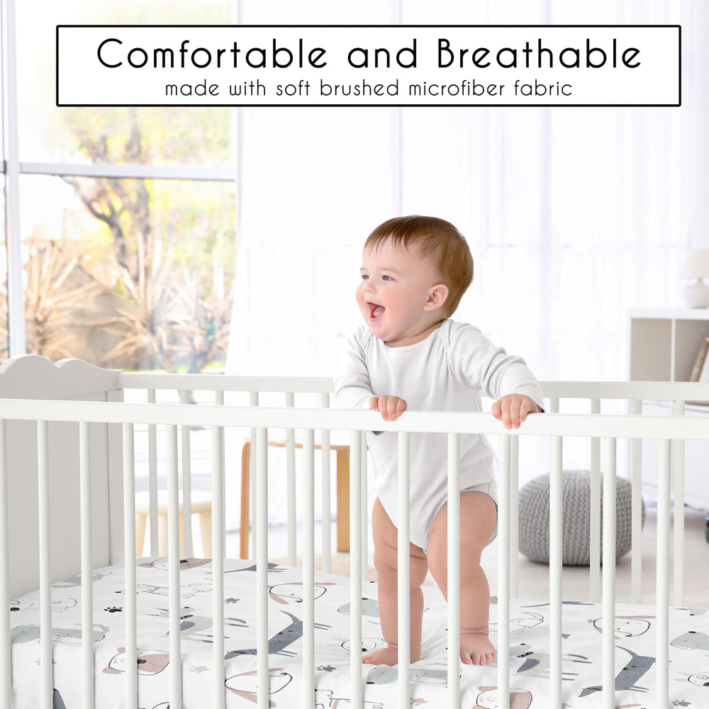 Sweet Jojo Designs Puppy Dog crib sheet on a crib demonstrates snug fit with full elastic edge