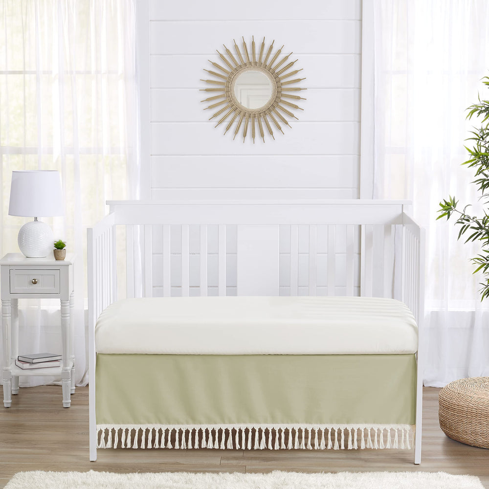 Sweet Jojo Designs sage green crib skirt tassel detail enhances cozy nursery aesthetics and hide-away storage area
