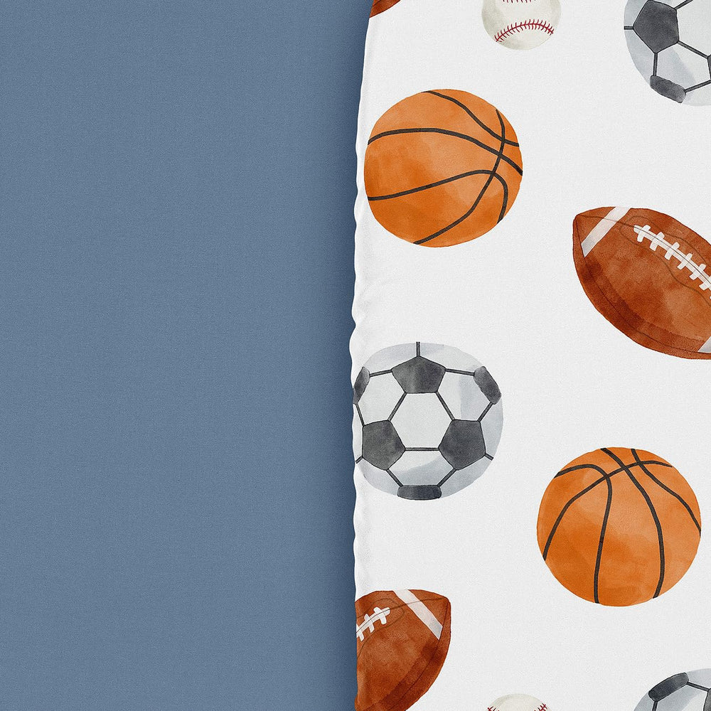 Sweet Jojo Designs sport-theme bassinet sheets blue print close-up highlights soft microfiber.