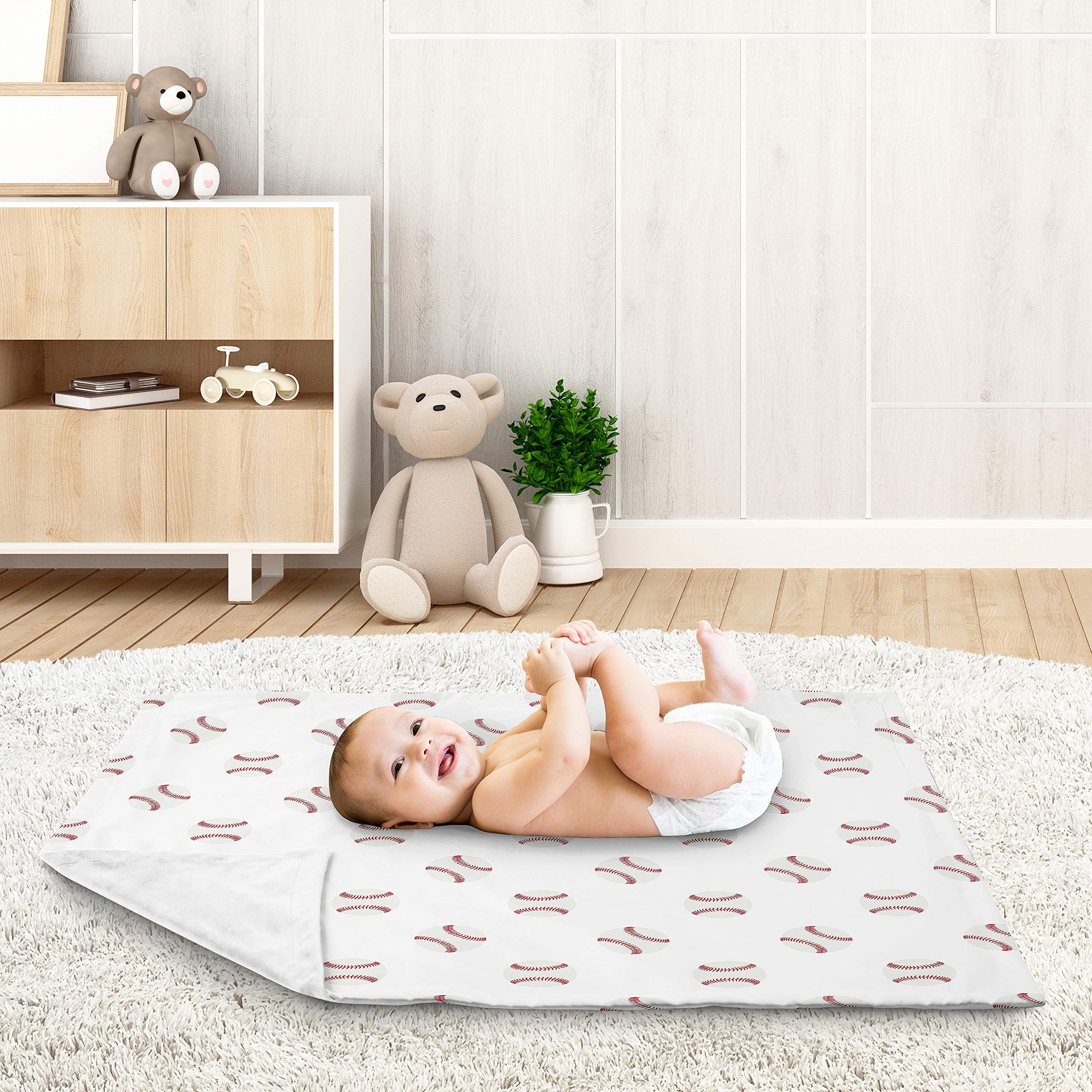 Sweet Jojo Designs swaddle blanket with soft minky reverse; plush warmth for soothing snuggles.