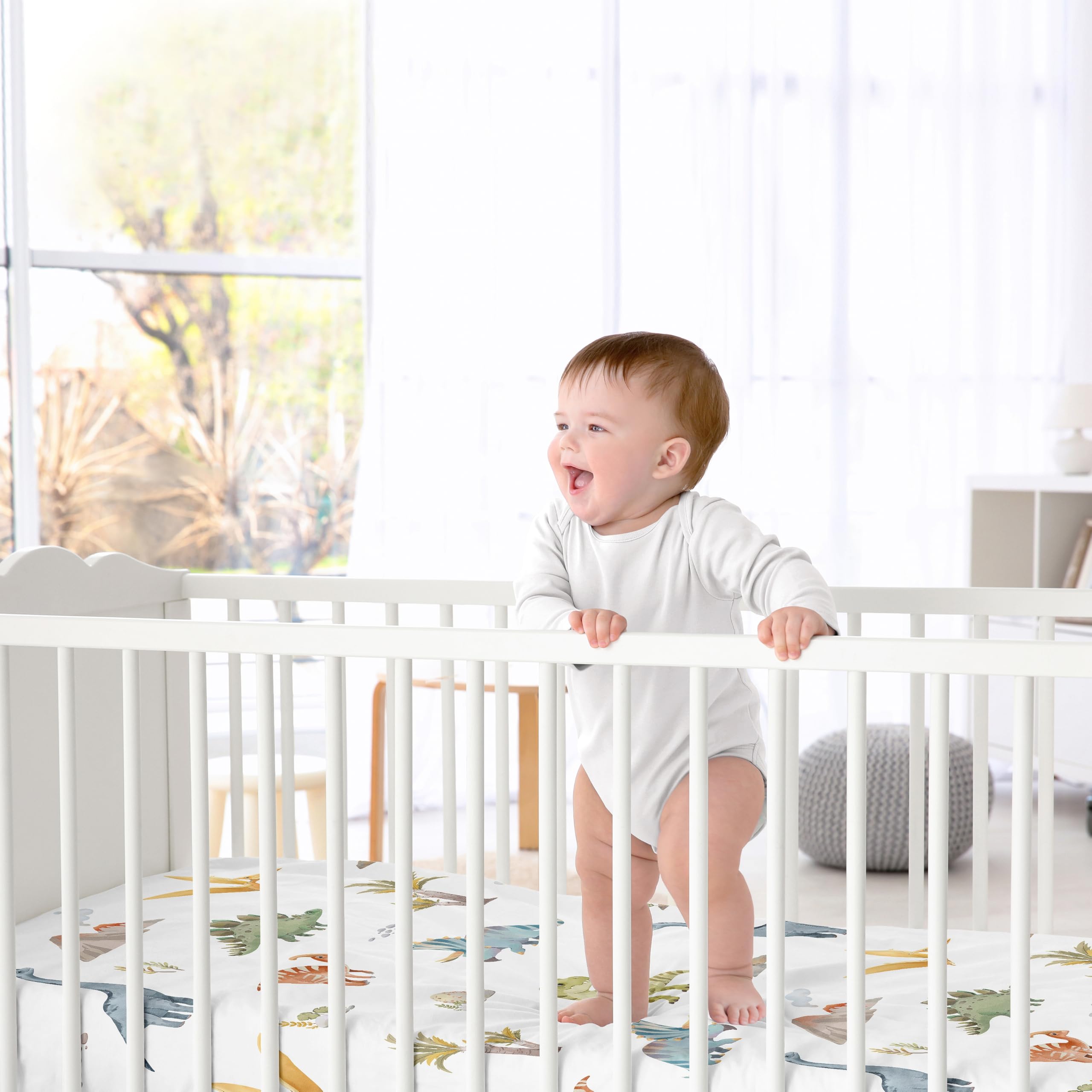 Sweet Jojo Designs watercolor dinosaur nursery colorway — coordinated look for gender-neutral decor.