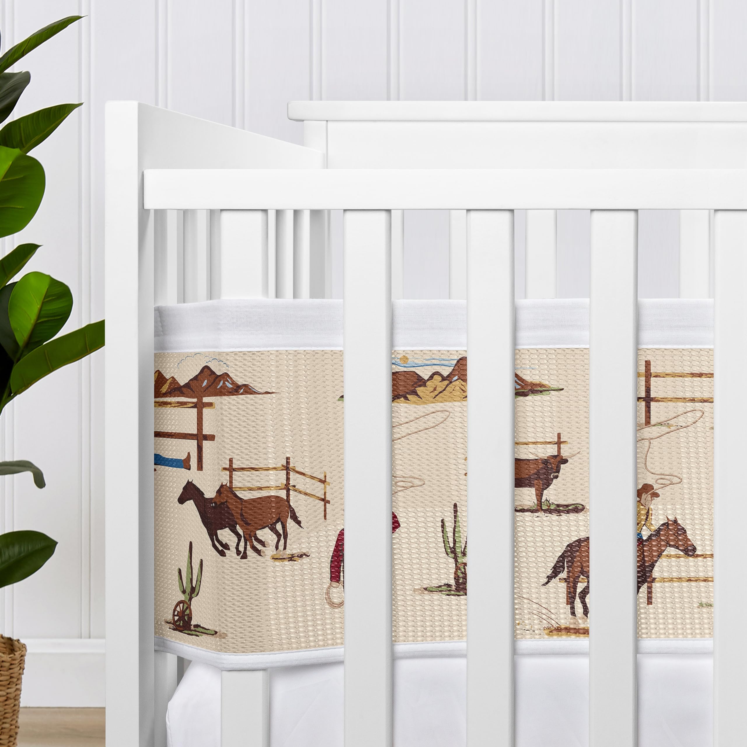 Sweet Jojo Designs Wild West print showcases tan and brown palette for coordinated nursery decor.