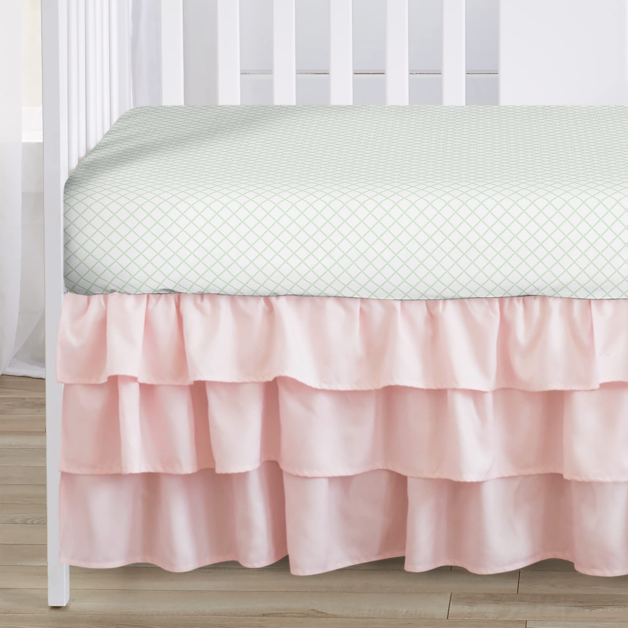 Sweet Jojo Designs woodland deer floral nursery setup pairs with coordinating pieces.