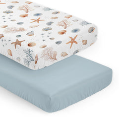 Sweet Jojo Designs Ocean Seashells crib sheets close-up of watercolor seashells for gentle, breathable sleep.