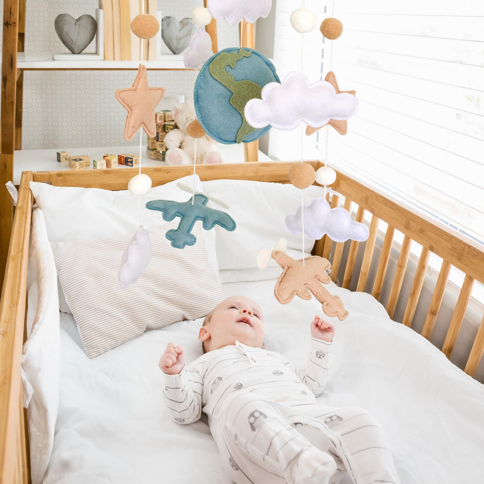 Sweety Baby neutral-tones airplane mobile blends with any nursery style.