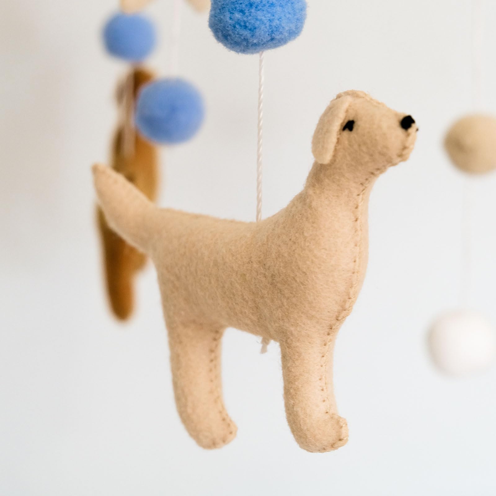 Sweety Baby dog mobile versatile for bassinets and play-n-packs in nurseries.