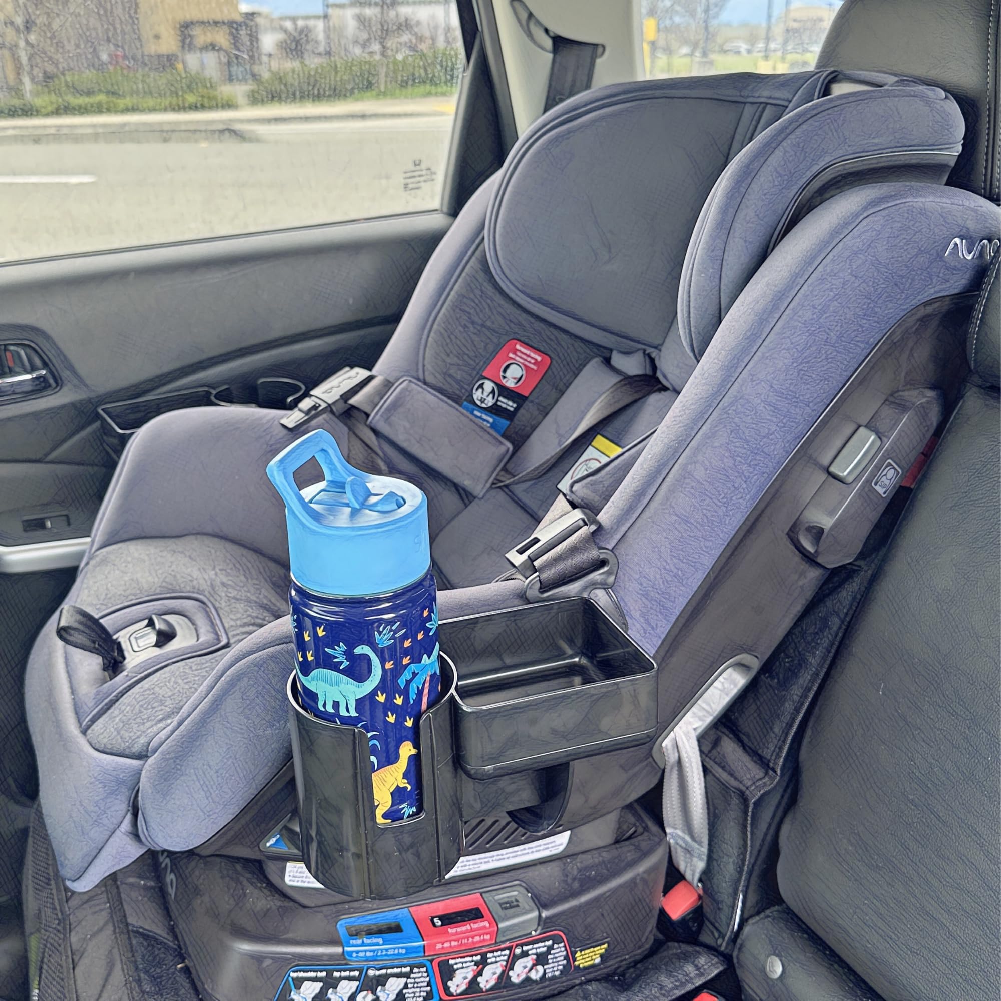 Swigzy cup holder fits bottles up to 3.1 inches on Nuna RAVA for hydration on the go.