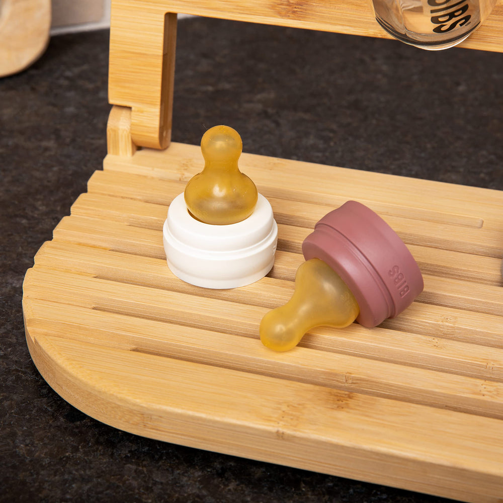 Sydney's Season bamboo bottle organizer complements home decor while drying bottles efficiently.
