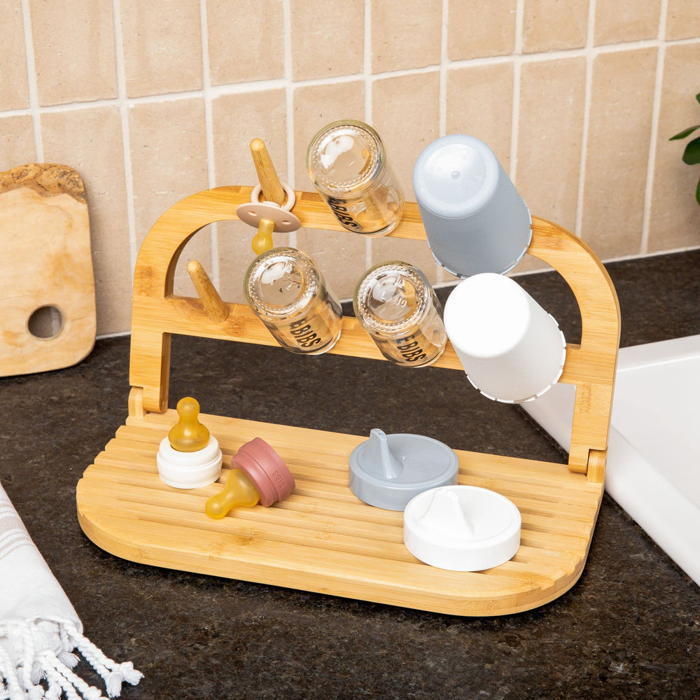 Sydney's Season bamboo drying rack emphasizes durable, sustainable storage for baby bottles.
