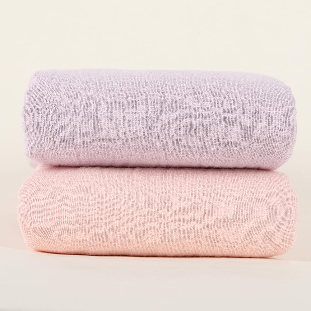 Synrroe baby nursery scene shows soft-touch blanket in crib.