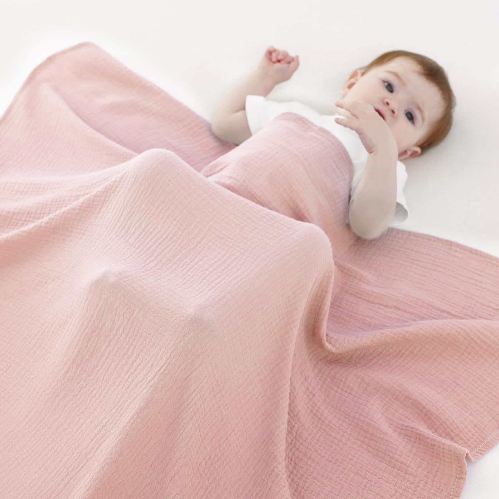 Synrroe muslin swaddle blanket baby wearing pose shows gentle wrap and soothing comfort.