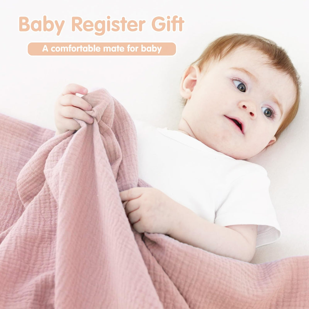 Synrroe muslin swaddle blanket close-up highlights 100% cotton weave and soft touch.