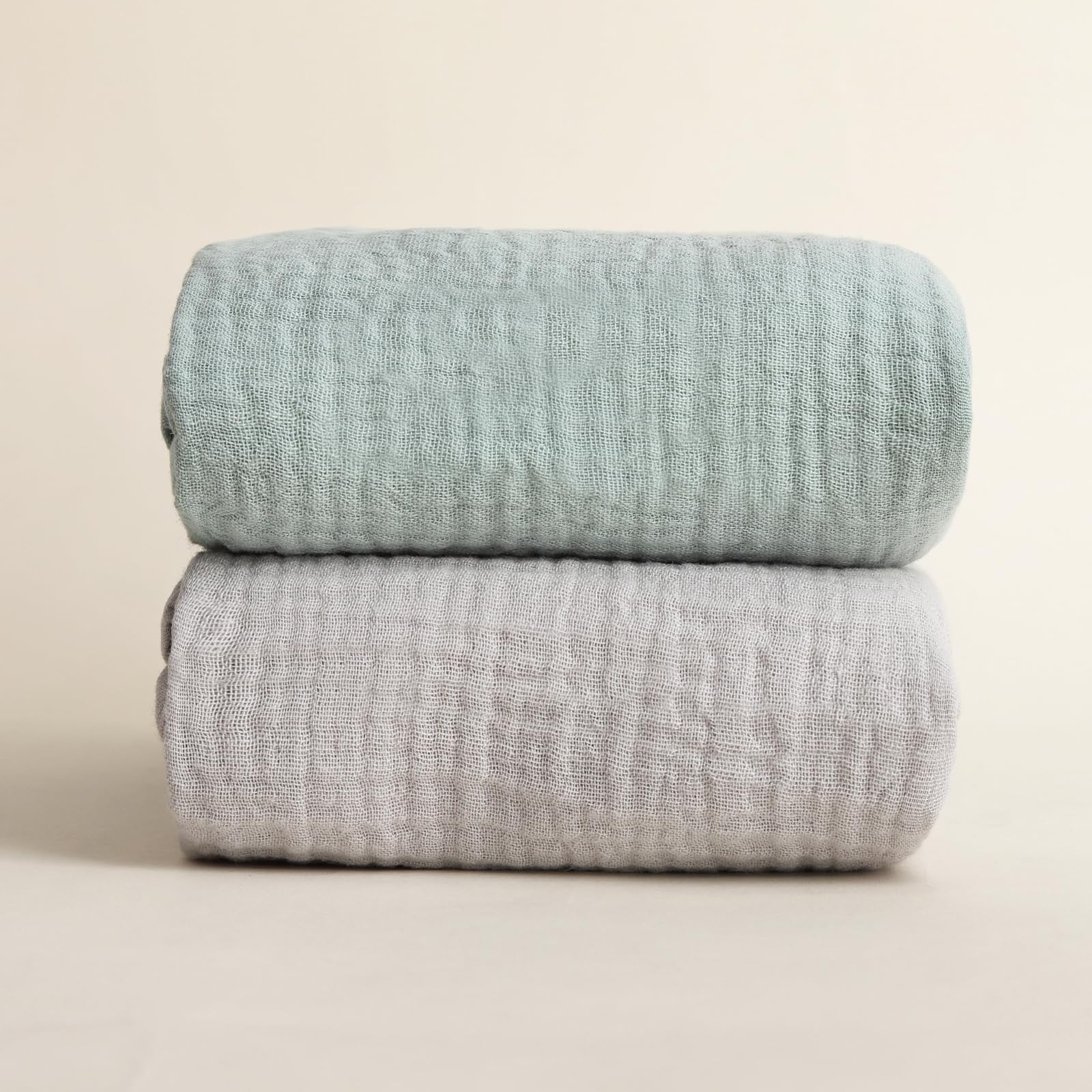 Synrroe muslin swaddle blanket showcases neutral colors complementing nursery decor