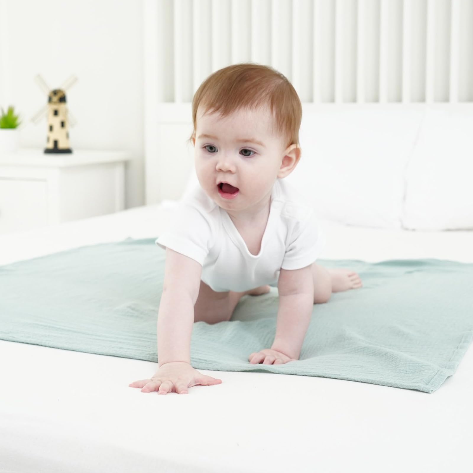 Synrroe muslin swaddle blanket used as stroller cover for sun and wind protection