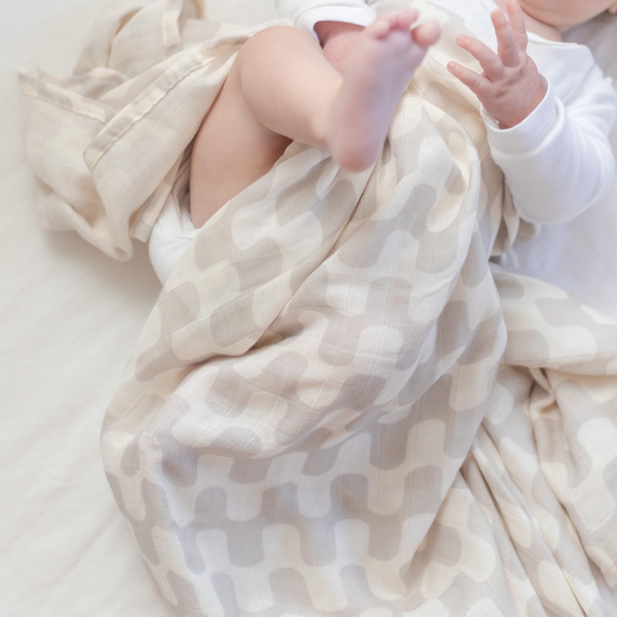 TAB swaddle offers generous size for light cover and tummy time.