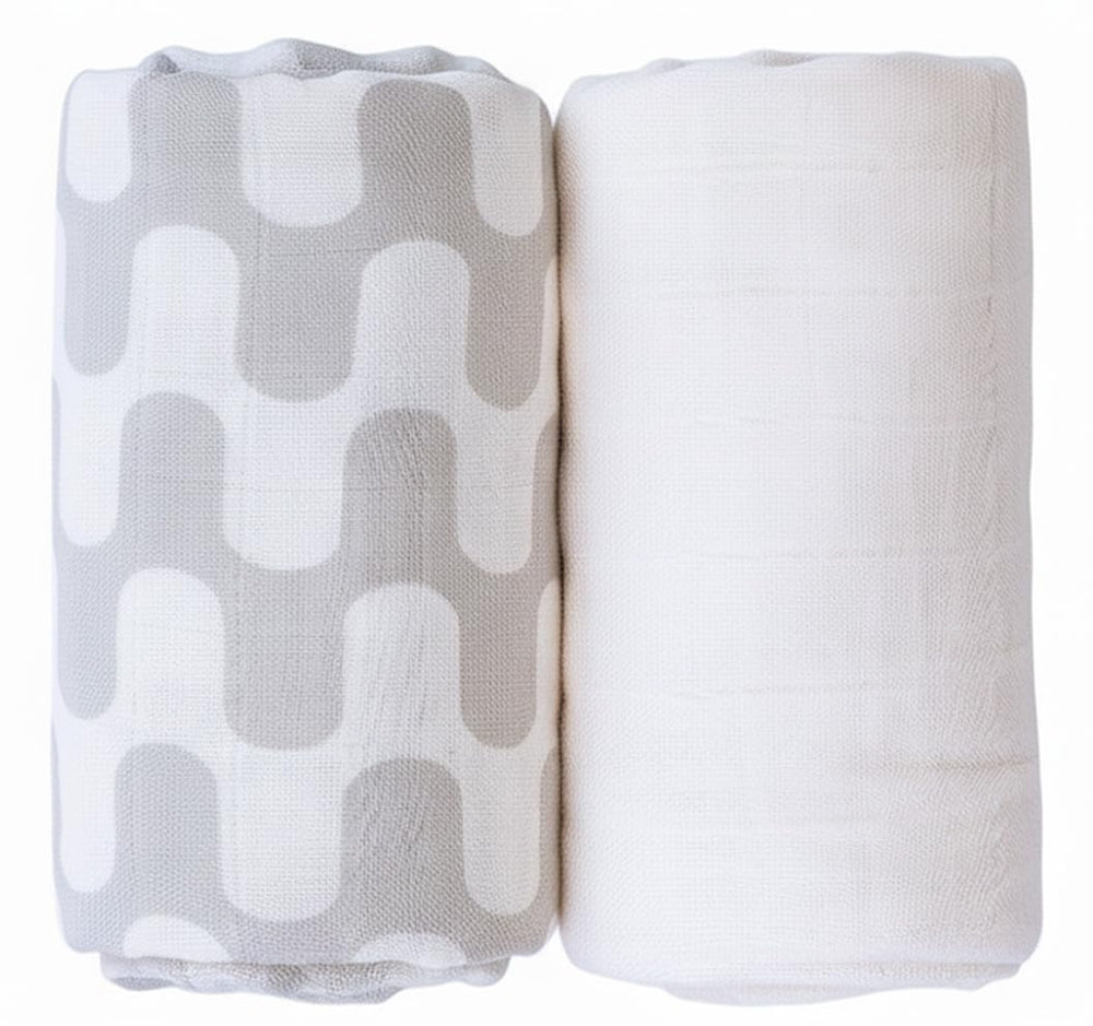 TAB muslin swaddle tan waves pattern offers versatile daily coverage.