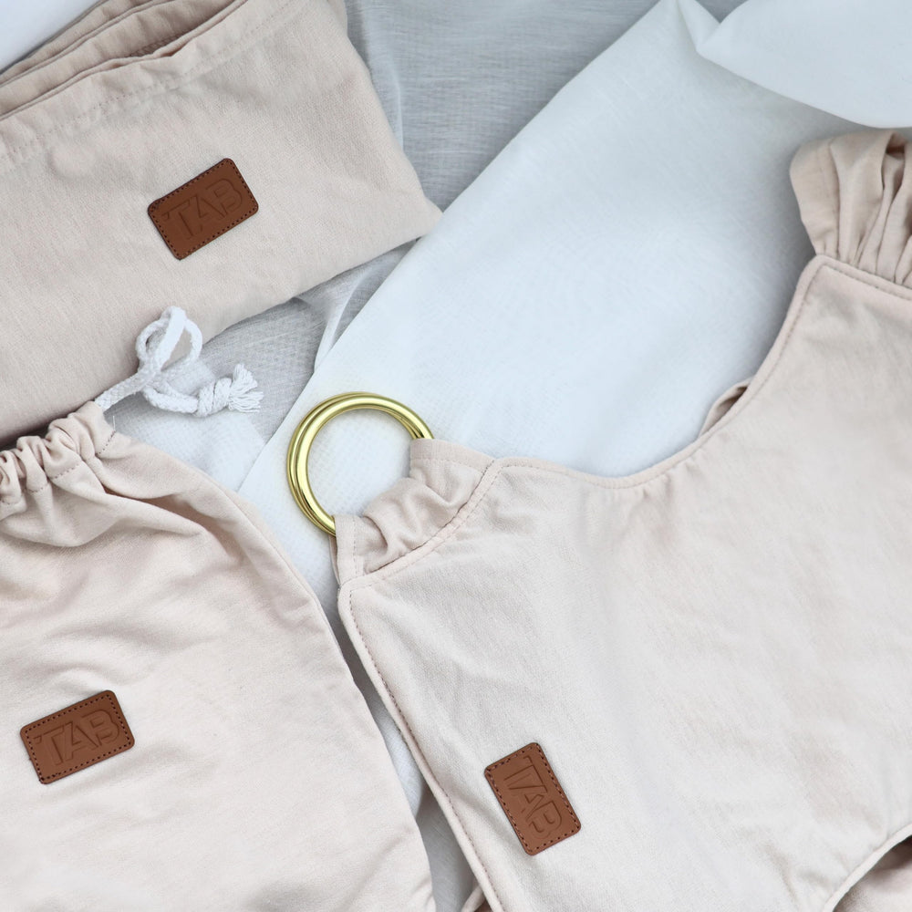 TAB baby wrap offers forward-facing, inward hug, and breastfeeding options.