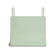 The Table Tyke silicone placemat in sage green lies flat for everyday meals and quick cleanup.