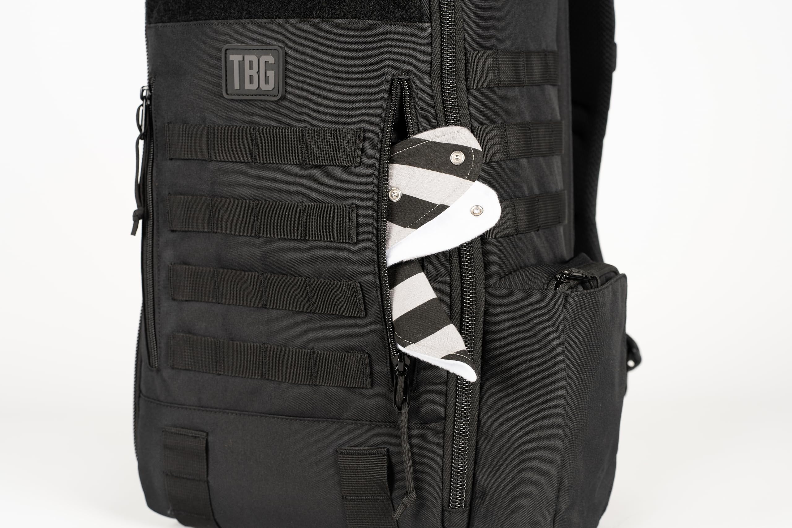 Tactical Baby Gear Daypack bottle pocket demonstrates easy-access feeding essentials.