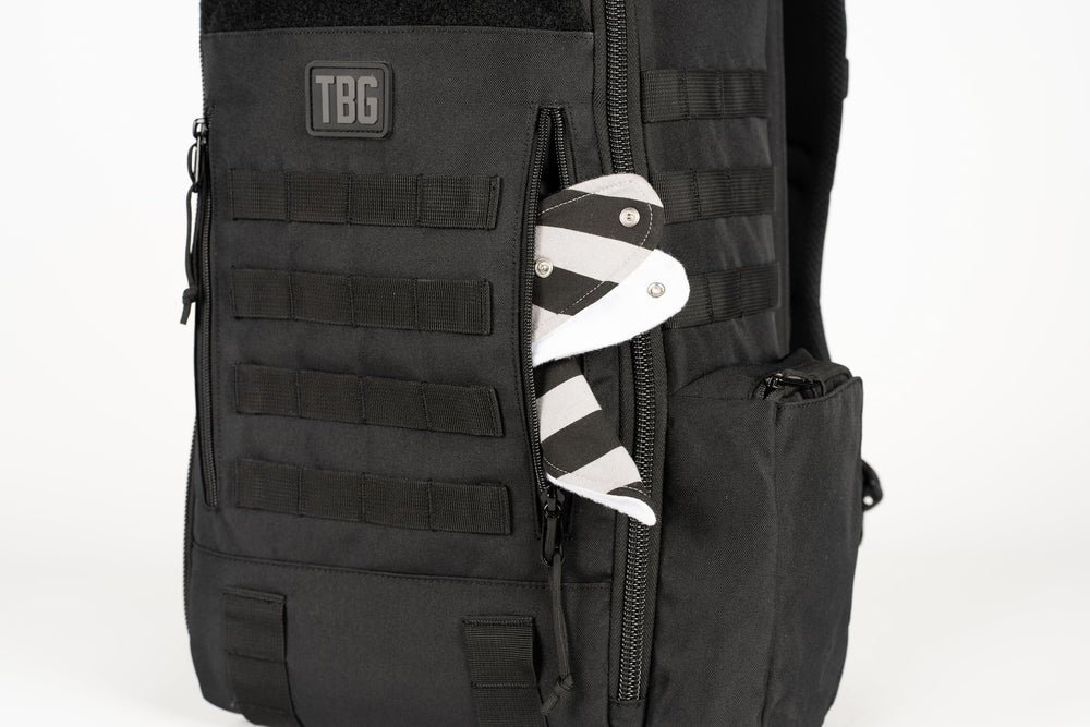 Tactical Baby Gear Daypack bottle pocket demonstrates easy-access feeding essentials.