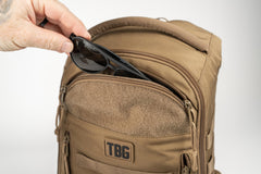Tactical Baby Gear Daypack attached to stroller via straps for hands-free access